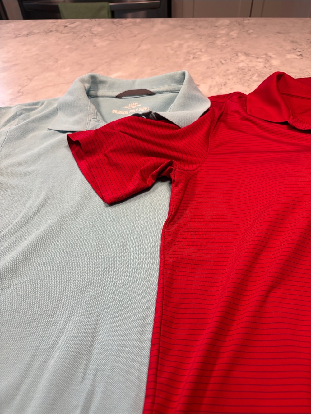 Two men’s golf polos